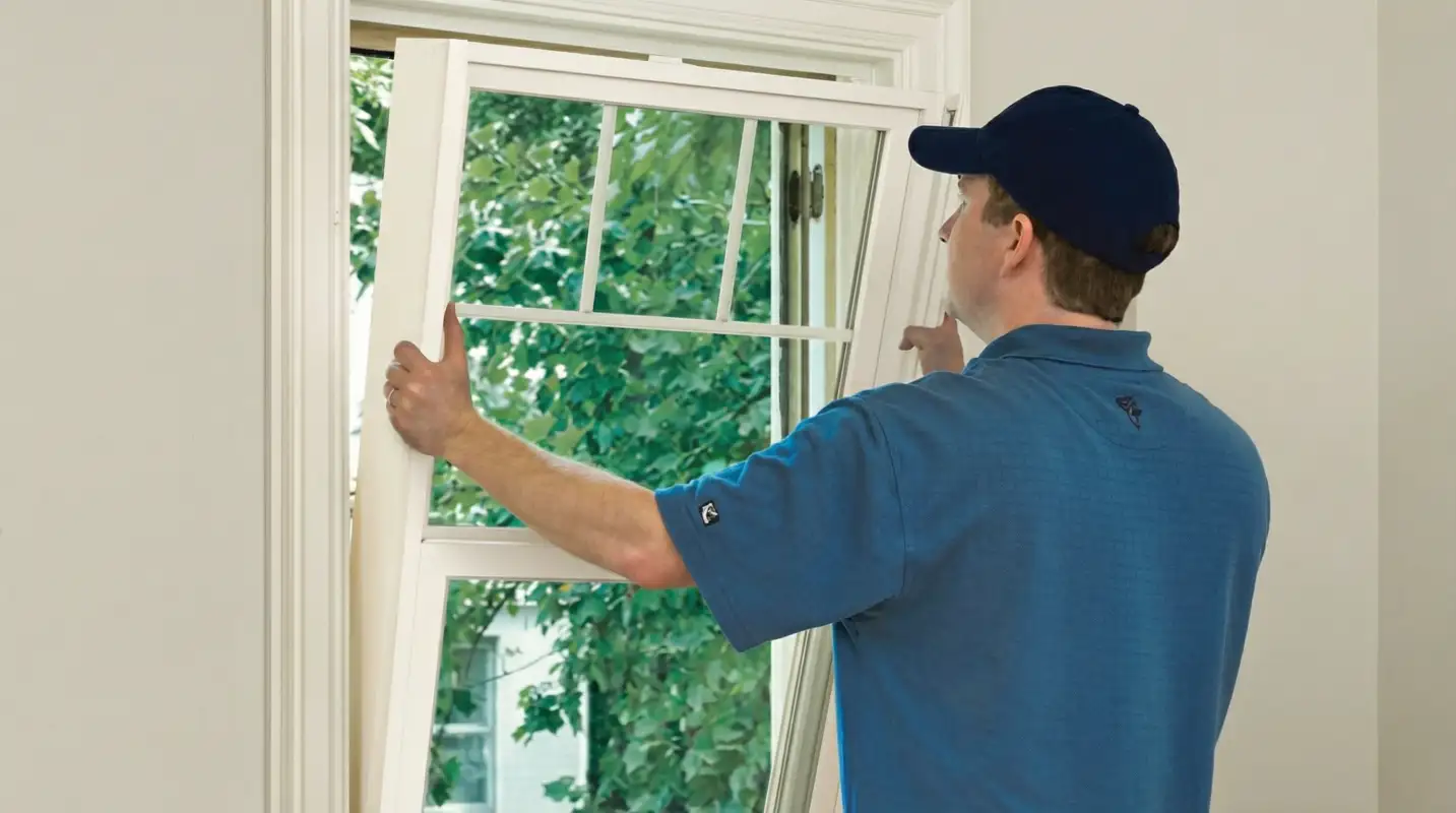 Professional contractors performing a residential window insulation and replacement service in Allentown, PA